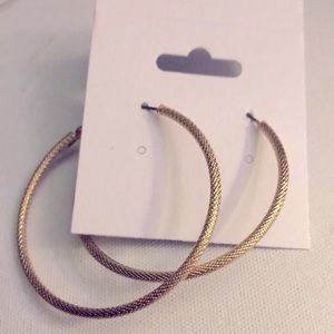 Gold hooped earrings.